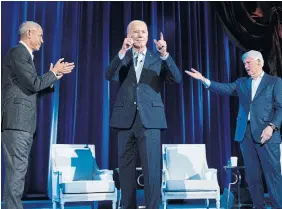  ?? BRENDAN SMIALOWSKI AFP VIA GETTY IMAGES ?? President Joe Biden has been raking in millions at fundraiser­s across the U.S., including $26 million (U.S.) at an event Thursday featuring Barack Obama and Bill Clinton.