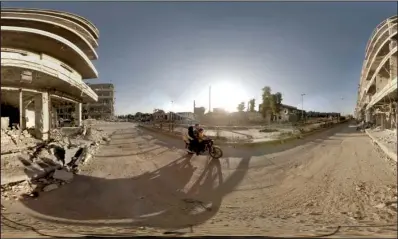  ??  ?? VIRTUALLY REAL: This image shows a scene from a virtual reality short film of Syrians traveling on the street near the Aleppo Bridge
snipers targeting the condensed area in Syria.