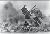  ?? Associated Press ?? SMOKE RISES from the USS Arizona as it sinks during the Dec. 7., 1941, attack by the Japanese military on Pearl Harbor.