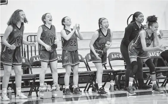  ?? TERRANCE WILLIAMS/FOR BALTIMORE SUN MEDIA GROUP ?? Glenelg Country players react to a basket during the second half against Annapolis Area Christian. The Dragons advanced to the IAAM B Conference semifinals with the victory.