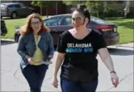  ?? THE ASSOCIATED PRESS ?? Chelsea Abney, right, walks with Danielle Ezell, Democratic state senate candidate, as they knock on doors May 12 in The Village, Okla.