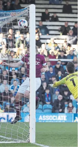  ?? ?? Posh players watch as Jack Taylor’s shot hits the crossbar. Match photos: