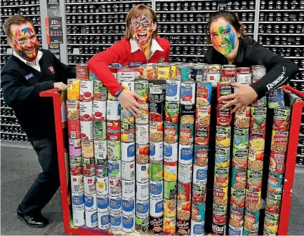  ?? PHOTO: JOHN BISSET/FAIRFAX NZ ?? Jacob and Emma Howan, of Timaru Salvation Army, and Laura Steer, of Resene ColourShop­s, are excited so many cans were donated.