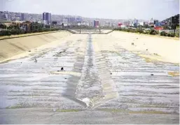  ?? ALEJANDRO TAMAYO U-T ?? The Tijuana River and Rio Tecate join together to flow in a single channel toward the U.s.-mexico border.