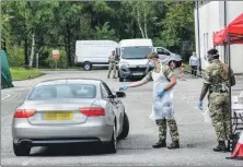  ??  ?? Soldiers from 2nd Battalion The Royal Regiment of Scotland manned the mobile testing unit in the hospital car park this week.