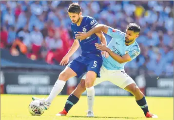  ??  ?? Chelsea’s midfielder Jorginho (L) vies with Manchester City’s striker Sergio Aguero during the English FA Community Shield match.