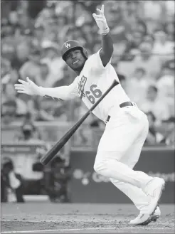  ?? Associated Press photo ?? Los Angeles Dodgers’ Yasiel Puig reacts after hitting an RBI single during the sixth inning of Game 5 of the National League Championsh­ip Series baseball game against the Milwaukee Brewers Wednesday in Los Angeles.