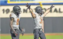  ?? [AP PHOTO/BRODY SCHMIDT] ?? OSU cornerback Rodarius Williams (8) and safety Tre Sterling (3) look to the sidelines during a 24-21 win over Iowa State on Oct. 24.