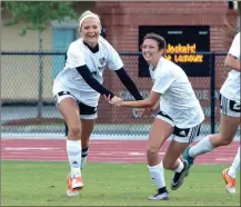  ?? TIM GODBEE / For the Calhoun Times ?? Calhoun’s Leah Prather (left) celebrates with teammate Halle Rhodes after Prather’s goal in the second minute on Friday.