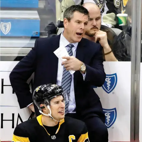  ?? GENE J. PUSKAR/THE ASSOCIATED PRESS ?? Pittsburgh Penguins head coach Mike Sullivan has his team trending in the right direction after a poor start.