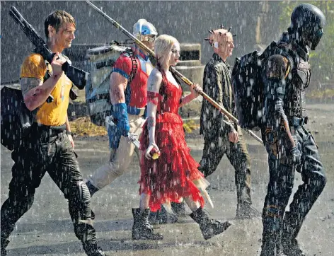  ??  ?? A blast of nitrous oxide: the cast of James Gunn’s dazzlingly colourful film includes (left to right, from centre) Margot Robbie, Peter Capaldi and Idris Elba