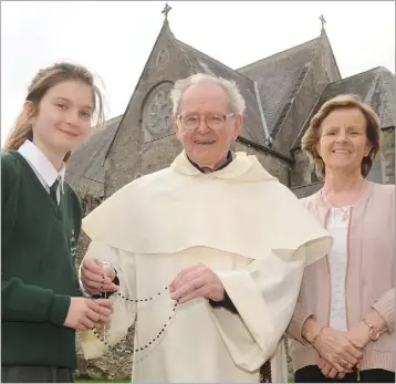  ??  ?? Principal, Brid Galligan, with 6th class pupil, Ruth McGee and Fr. Gabriel Harty OP at St. Malachy’s Girls’ National School.