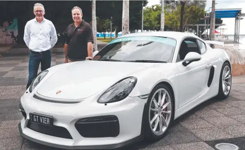  ?? Picture: BRENDAN RADKE ?? HOT WHEELS: Targa Australia chief executive Mark Perry with Scott Smith, who will drive his 2016 Porsche Cayman GT4 in the Targa with his son, Mitchell Smith.