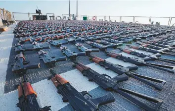  ?? AFP ?? AK-47 assault rifles on the flight deck of USS The Sullivans during an inventory process, after they were reportedly seized from a fishing vessel in internatio­nal waters of the Gulf of Oman.