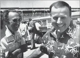  ??  ?? The Associated Press Four-time Indianapol­is 500 winner A.J. Foyt, right, gives mechanic George Bignotti, left, a friendly pinch to the stomach May 7, 1979, at Indianapol­is Motor Speedway.