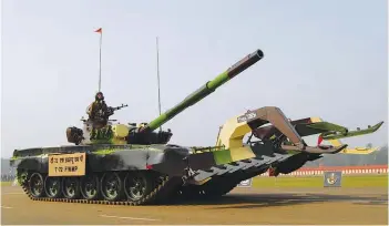  ??  ?? (Top) Indian Army’s T-90 Bhishma tank and (above) T-72 equipped with full width mine plough