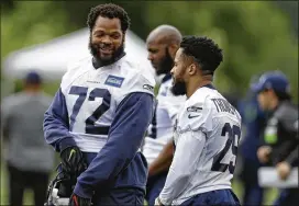  ?? AP FILE ?? The Seahawks could be ready to overhaul their star-studded defensive unit, and may be looking to part with veterans Michael Bennett (left) and free safety Earl Thomas.