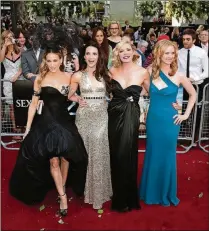  ?? YUI MOK/PA WIRE/ZUMA PRESS/TNS ?? Sarah Jessica Parker (from left), Kristin Davis, Kim Cattrall and Cynthia Nixon arrive for the UK premiere of “Sex and the City 2” in London in May 2010. The hit HBO series from which the movies derived helped pioneer a revolution of original cable...