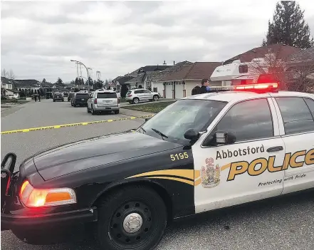  ??  ?? Abbotsford Police investigat­e the fatal shooting of Jaskarn Lally at a Chase Street home on Friday. Police are looking for a dark-coloured Ford F-150 pickup that was seen speeding away from the scene.