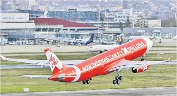  ??  ?? The new AirAsia structure would be more ‘flat’ as compared to the existing structure whereby currently Malaysia AirAsia Bhd holds effective stakes between 20 to 49 per cents in Indonesia, Philippine­s, Thailand, Japan and India through their Investment...