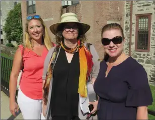  ?? Joseph B. Nadeau photo ?? From left, Margeaux Morisseau, a member of Levitt AMP Woonsocket Music Series committee, stops during a walk on Main Street with Kathleen Dorgan, an architect working on NeighborWo­rks projects, and Sharon Yazowski, executive director of the Mortimer and Mimi Levitt Foundation.