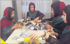  ?? AHMAD SEIR / AP ?? Teens from the Afghanista­n Robotic House practice their skills in Herat, Afghanista­n. They competed Monday in the internatio­nal competitio­n in Washington, D.C.