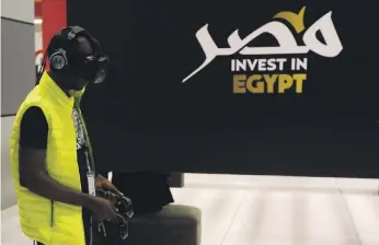  ?? Reuters ?? A visitor uses virtual reality glasses at the Africa 2018 Forum