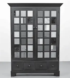  ?? HANDOUT ?? The influence of quilting is clear in the colorful blocks that make up the doors of this steel cabinet. It sold for $1,400 at Palm Beach Modern Auctions’ Modern + Contempora­ry Art & Design auction.