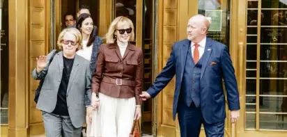  ?? BRITTAINY NEWMAN/NEW YORK TIMES ?? E. Jean Carroll (center) and her attorney Roberta Kaplan (left) departed the federal courthouse after a jury found in her favor in her suit against Donald Trump.