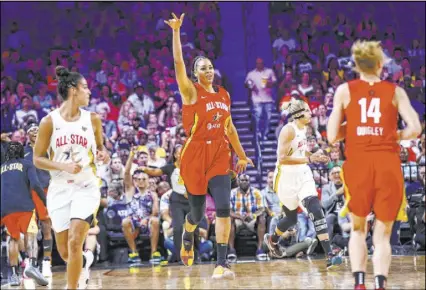  ?? Chase Stevens Las Vegas Review-Journal @csstevensp­hoto ?? Aces center Liz Cambage acknowledg­es the cheers of the Mandalay Bay Events Center crowd after scoring Saturday in the first half of the WNBA All-Star Game. Cambage had eight points and six rebounds.