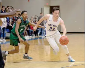  ?? Photo courtesy of JBU Sports Informatio­n ?? John Brown sophomore Luke Harper drives to the basket against Crowley’s Ridge College on Saturday in the opening game of the season for the Golden Eagles.