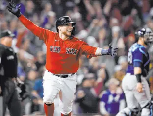  ?? Charles Krupa The Associated Press ?? Christian Vazquez rounds the bases after hitting a walk-off home run in the 13th inning of the Red Sox’s 6-4 win over the Rays on Sunday at Fenway Park.