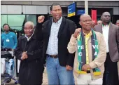  ??  ?? CLANSMEN: Zwelithamb­ile Mandela, left, and Mandla Mandela, centre, are warmly welcomed by KZN ANC secretary Super Zuma at King Shaka Internatio­nal Airport yesterday.