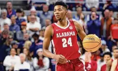  ?? Butch Dill/Associated Press ?? Alabama forward Brandon Miller brings the ball up during the first half against Auburn on Feb. 11 in Auburn, Ala.