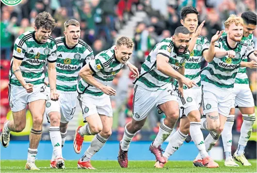  ?? ?? The Celtic players rush from the halfway line to congratula­te keeper Joe Hart after his crucial save in yesterday’s shoot-out win at Hampden.