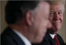  ??  ?? In this May 18 file photo, President Donald Trump smiles as he listens to Colombian President Juan Manuel Santos speak during a news conference in the East Room of the White House, in Washington. AP PHOTO/ANDREW HARNIK