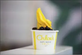  ?? MICHAEL NOBLE JR. — THE ASSOCIATED PRESS ?? A cup of vegan mango soft serve with blackberri­es at Chloe’s Soft Serve Fruit Co. in New York.