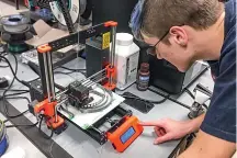  ??  ?? A 3D printer being used to print personal protective equipment in response to the lack of safety gear for medical profession­als (Credit: https://www.usda.gov)