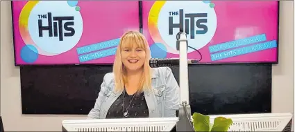  ??  ?? The Hits Taranaki announcer Emma in her new studio.