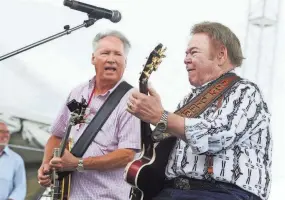  ?? SAMUEL M. SIMPKINS/NASHVILLE TENNESSEAN ?? Roy Clark, right, performs with Buck Trent during the CMA Music Festival in downtown Nashville on June 12, 2011.