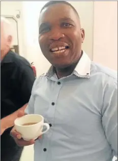  ??  ?? POTENTIAL MISSILE: ANC councillor Siphiwo Plaatjies finishes his coffee outside the chamber after he was prevented from entering with the cup