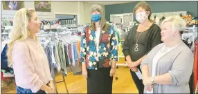  ?? Westside Eagle Observer/SUSAN HOLLAND ?? Sammy Laney (left), owner and director of the DEB Project in Bentonvill­e, visits with Maribel Childress, Gravette school superinten­dent; Heather Finley, Gravette school board president; and Kris Davis, Decatur schools social worker, in the DEB Project thrift store Aug. 17.