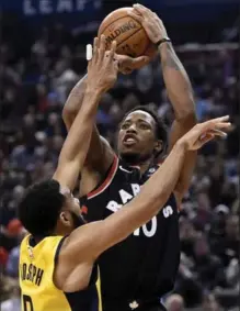  ?? NATHAN DENETTE, THE CANADIAN PRESS ?? Raptors’ DeMar DeRozan attempts to shoot over Pacers’ Cory Joseph, an ex-teammate, at Air Canada Centre in Toronto on Friday night.