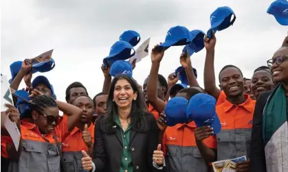  ?? Photograph: Stefan Rousseau/PA ?? Suella Braverman in Kigali, Rwanda, in March, with workers who were planning to construct houses for deported migrants from the UK.