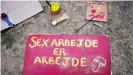  ??  ?? Sex workers are becoming increasing­ly stigmatize­d in Denmark. This sign reads: 'Sex work is also work'