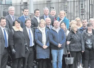  ??  ?? Families of some of the victims of the so-called Glenanne Gang outside Belfast High Court yesterday