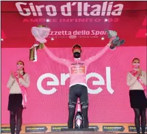  ??  ?? Wilco Kelderman of The Netherland­s wears the pink jersey of the race overall leader during the podium ceremony for the 18th stage of the Giro d’Italia cycling race from Pinzolo to Laghi di Cancano, northern Italy, on
Oct 22. (AP)