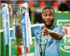  ??  ?? What have you got?: Manchester City’s Raheem Sterling posing with the English League Cup trophy after beating Chelsea in the final at Wembley last Sunday. — Reuters