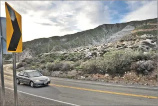  ?? Signal file photo ?? A car drives past the Cemex mining site which can be seen from Soledad Canyon Road near Auga Dulce Canyon Road in Canyon Country. Congressma­n Steve Knight agreed to co-sponsor House Resolution 4086, which would expand the existing Santa Monica...