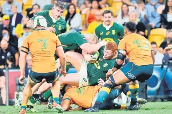  ?? — AFP file photo ?? South Africa’s Steven Kitshoff (centre) is tackled in a ruck during the Championsh­ip match against Australia at the Suncorp Stadium in Brisbane.